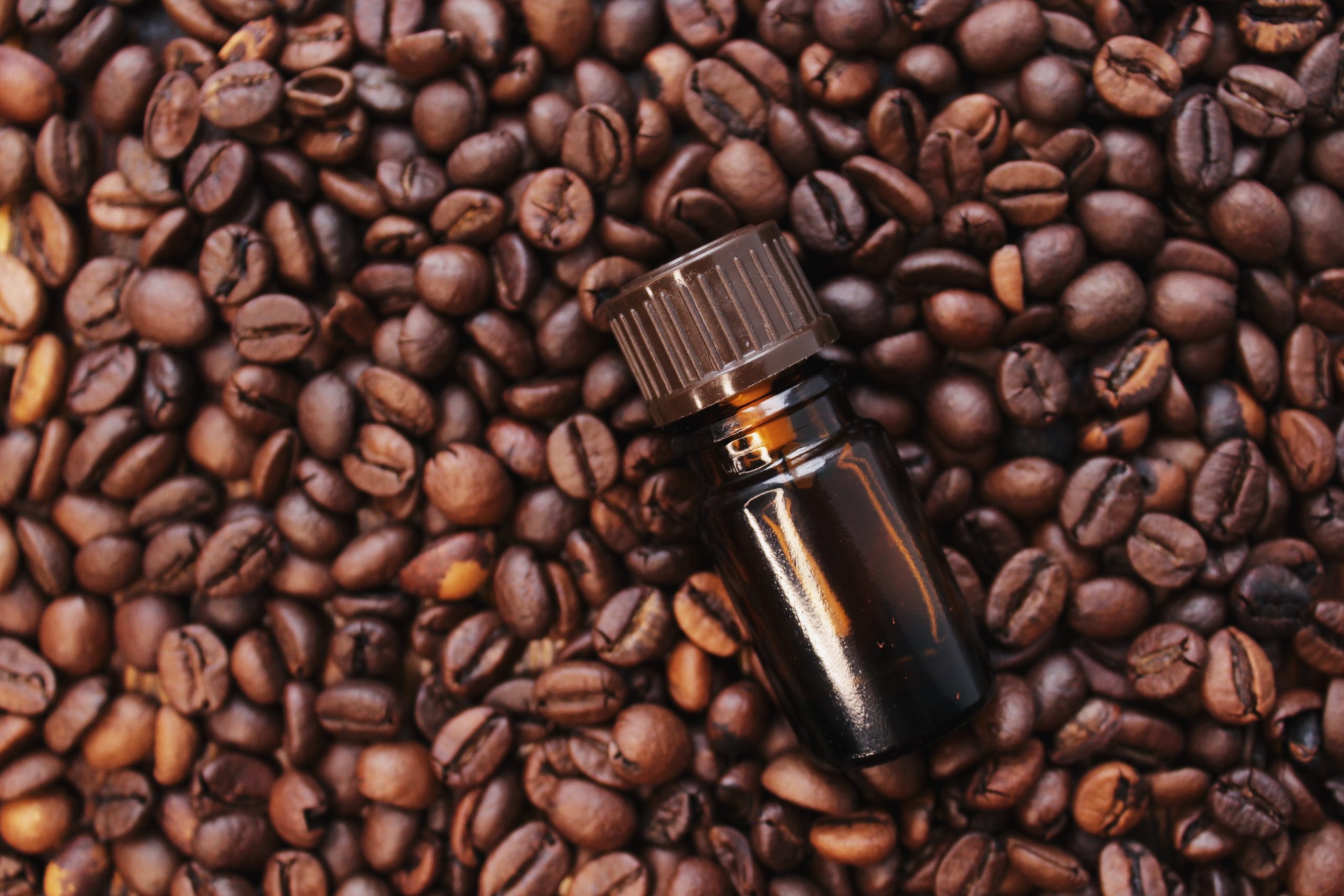 coffee-essential-oil-in-a-glass-bottle-coffee-bea-2022-11-11-21-39-00-utc-scaled-2